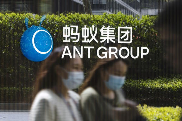 Employees walk past a logo at the Ant Group headquarters in Hangzhou, China. Photo: Bloomberg