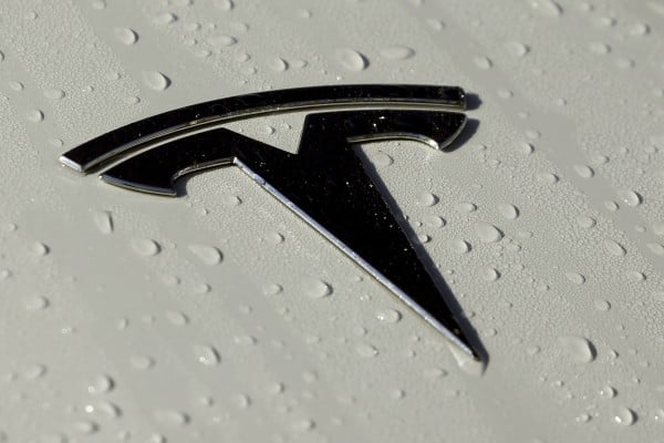 A Tesla logo seen in Salt Lake City on October 18, 2019. The government plans soon to release data on collisions involving vehicles with autonomous or partially automated driving systems that will likely single out Teslas for a disproportionately high number of such crashes. Photo: AP A Tesla logo seen in Salt Lake City on October 18, 2019. The government plans soon to release data on collisions involving vehicles with autonomous or partially automated driving systems that will likely single out Teslas for a disproportionately high number of such crashes. Photo: AP