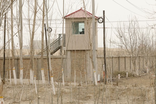 A security person watches from a guard tower around a detention facility in Yarkent County in northwestern China’s Xinjiang Uyghur Autonomous Region. Photo: AP