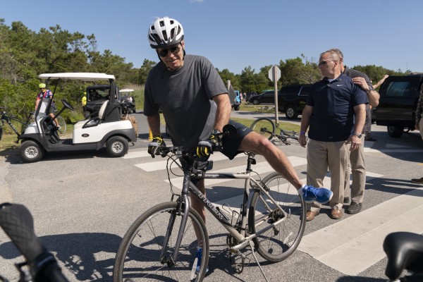 US President Joe Biden gets back on his bike after a fall at Gordons Pond in Rehoboth Beach, Delaware, US on Saturday. Photo: AP 