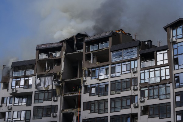 Smoke rises from a residential building damaged by a Russian missile strike in Kyiv, Ukraine, on Sunday. Photo: AP
