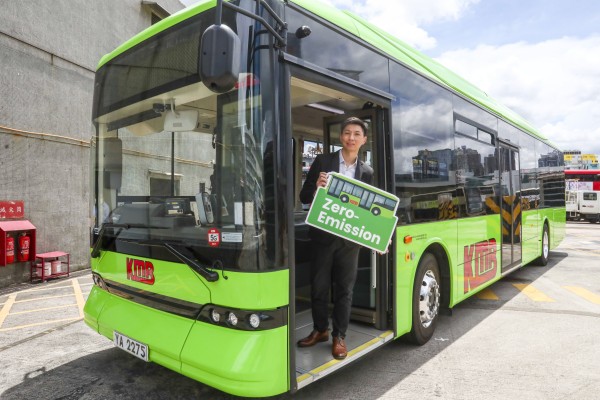 Addie Lam Tze-ho, assistant director of communications with Kowloon Motor Bus, poses on the company’s new electric single-deck bus at a depot in Kowloon Bay on June 29, 2022. Photo: SCMP / Jonathan Wong