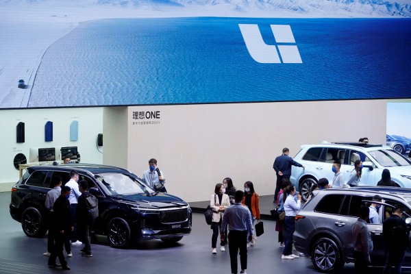 People visit the booth of Chinese electric vehicle maker Li Auto during a media day for the Auto Shanghai show on April 20, 2021. Photo: