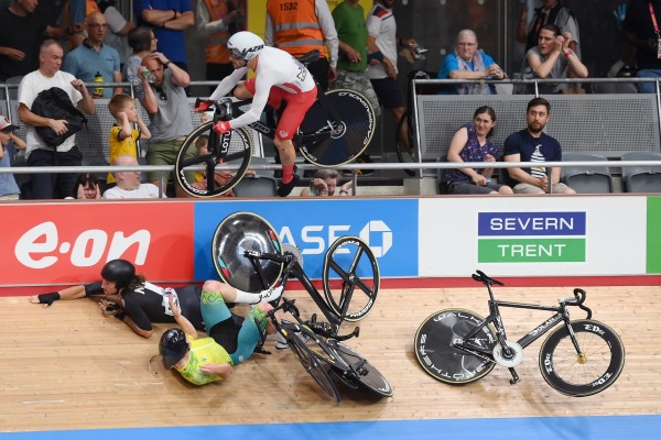 Matt Walls (top) of England crashes during the Men’s 15km Scratch Race on Day 3 of the Commonwealth Games. Photo: EPA-EFE