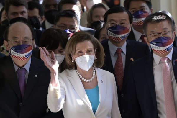 US House Speaker Nancy Pelosi waves to journalists during her arrival at the Parliament in Taipei on Wednesday. Photo: AFP