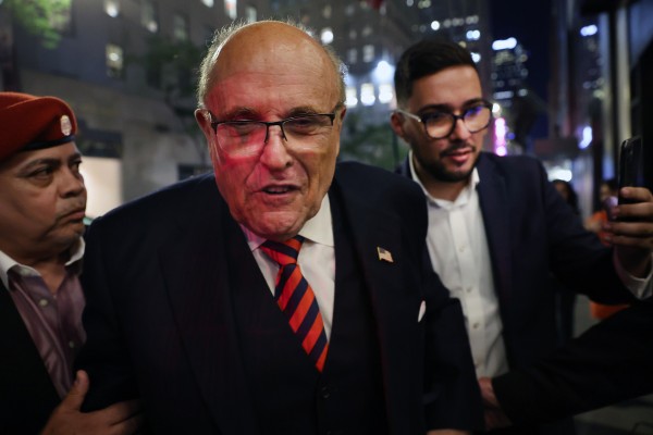 Former New York city mayor Rudy Giuliani, centre, in New York on June 28. Photo: Getty Images / TNS
