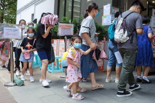 Parents bring their young children for jabs at the Kwun Chung Municipal Services Building. Photo: Edmond So