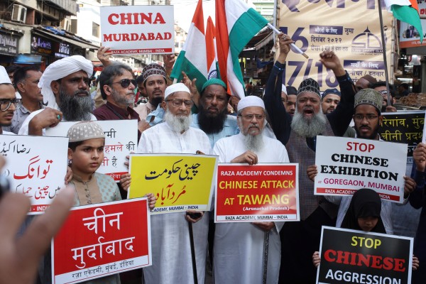 Demonstrators in Mumbai, India, hold signs during a protest against China on Tuesday. A scuffle last week on the two countries’ Himalayan border left soldiers on both sides injured. Photo: Reuters