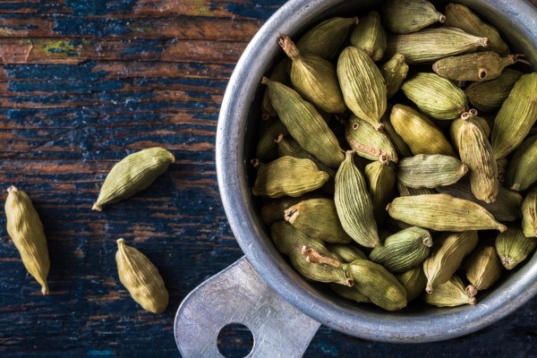 A cup full of cardamom pods. The seeds they contain have many potential health benefits, say practitioners of Ayurveda - traditional Indian medicine. Photo: Getty Images
