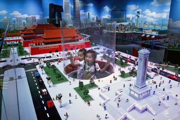 Children play inside a Lego model of the Forbidden City and Tiananmen Square at the Legoland Discovery Centre in Beijing in 2019. Photo: AP