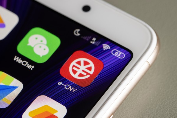 The mobile icons of China’s e-CNY platform and Tencent Holdings’ multipurpose WeChat super app are displayed on a smartphone screen. Photo: Shutterstock