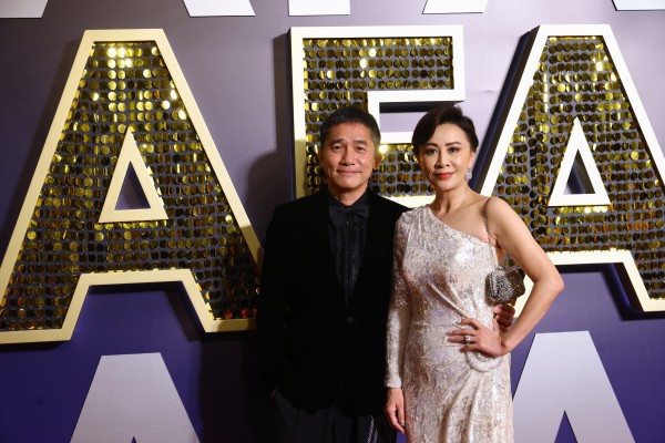 Tony Leung and his wife Carina Lau Kar-ling at the Asian Film Awards in Hong Kong on Sunday. Photo: Dickson Lee