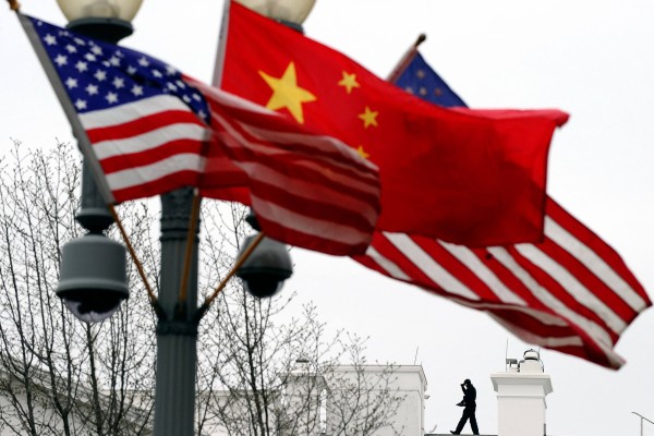 Chinese and US national flags. US intelligence officials have renewed warnings for American companies doing business in China. Photo: AFP