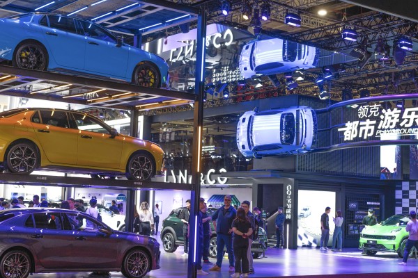 People walk at the Link & Co company booth during the second press day of the 20th Shanghai International Automobile Industry Exhibition in Shanghai on April 19, 2023. China’s auto industry, an electric vehicles in particular, are seen as a bright spot in global semiconductor demand. Photos: EPA-EFE