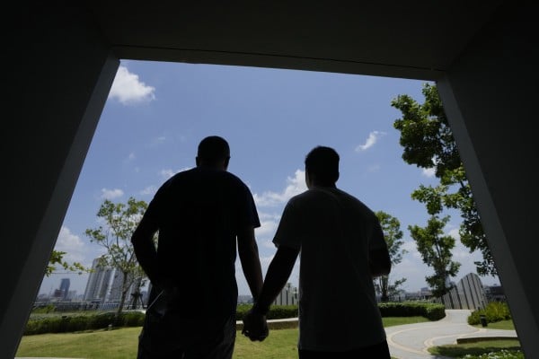 A gay Chinese couple tour a condominium block in Bangkok last month. Thailand is proving to be a huge draw for LGBTQ people from China who are frequently scorned and ostracised at home. Photo: AP A gay Chinese couple tour a condominium block in Bangkok last month. Thailand is proving to be a huge draw for LGBTQ people from China who are frequently scorned and ostracised at home. Photo: AP