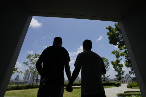 A gay Chinese couple tour a condominium block in Bangkok last month. Thailand is proving to be a huge draw for LGBTQ people from China who are frequently scorned and ostracised at home. Photo: AP