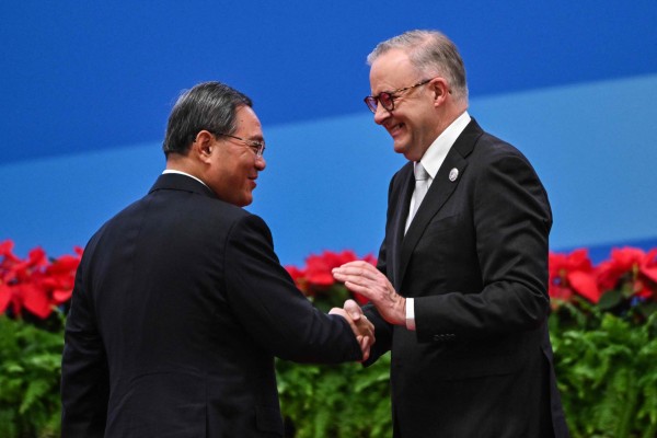 Chinese Premier Li Qiang (left) and Australian Prime Minister Anthony Albanese shake hands during the opening ceremony of the sixth China International Import Expo (CIIE) in Shanghai on Sunday. Photo: AFP