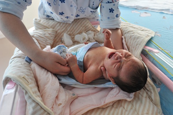 A baby being given a health check by a nurse in Anhui, China on January 17. Photo: Getty Images