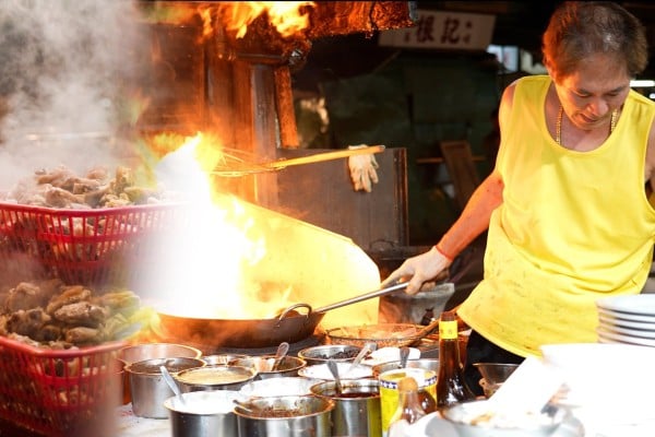 This video explores the history behind the famed food stalls and the families that run them.