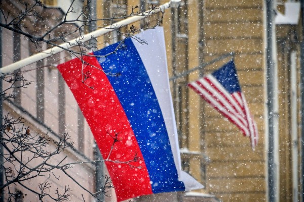 A Russian flag flies next to the US embassy building in Moscow in November. Photo: AFP