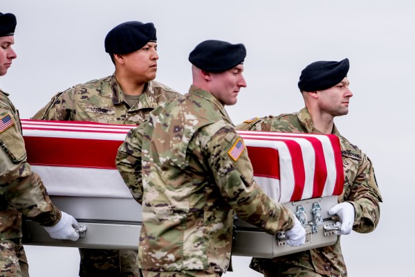 The US Army Old Guard Carry Team conducts a transfer of the bodies of three US service members at Dover Air Force Base in Delaware on Friday. Photo: dpa