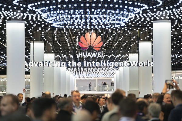 Attendees walk through Huawei Technologies’ stand at trade show MWC Barcelona in Spain on February 26, 2024. Photo: AP