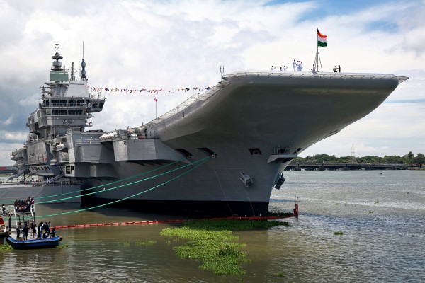 Indian Navy officers stand on the flight deck of the country’s first home-built aircraft carrier on September 2, 2022. India said it will bolster its forces by opening navy base near China-friendly Maldives Photo: Reuters