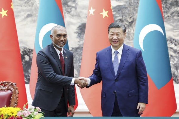 Chinese President Xi Jinping shakes hands with Maldives President Mohamed Muizzu during the latter’s visit to Beijing in January. Photo: Xinhua