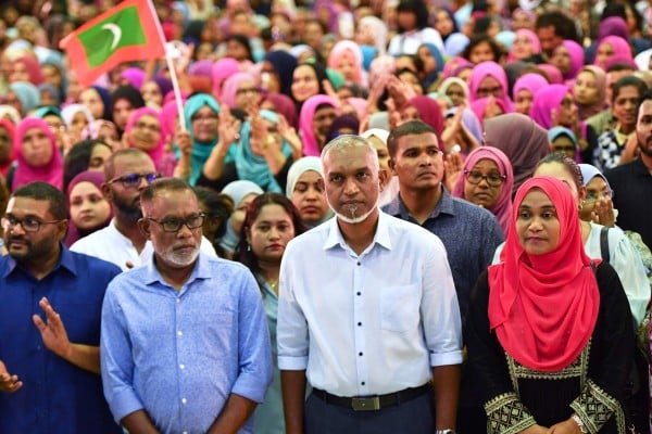 Then-president-elect Mohamed Muizzu (centre, in light blue shirt) of the Maldives delivers a speech in Male following the country’s presidential election on October 2, 2023. Photo: AFP