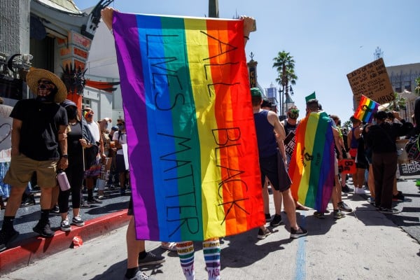 All Black Lives Matter protesters hold pride flags during a 2020 rally in Los Angeles. Photo: EPA-EFE