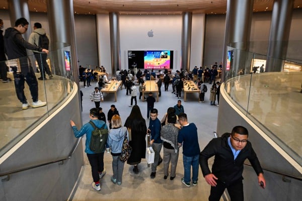 People visit a recently-opened Apple Store in Shanghai’s Jing’an district, March 26, 2024. Photo: AFP