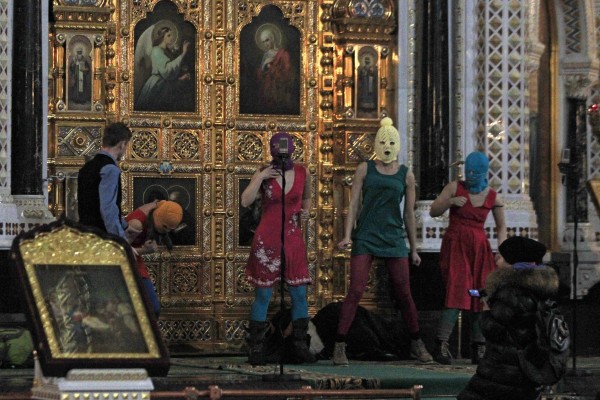 Masked members of Russian feminist group Pussy Riot protest inside the Christ the Savior Cathedral in Moscow in 2012. On Wednesday, Russia sentenced band member Lyusya Shtein to six years in prison in absentia for anti-war social media posts. Photo: AP