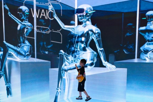 A child visits the World Artificial Intelligence Conference in Shanghai on July 6. China is looking to enhance its patent reviews in fields such as AI. Photo: AFP