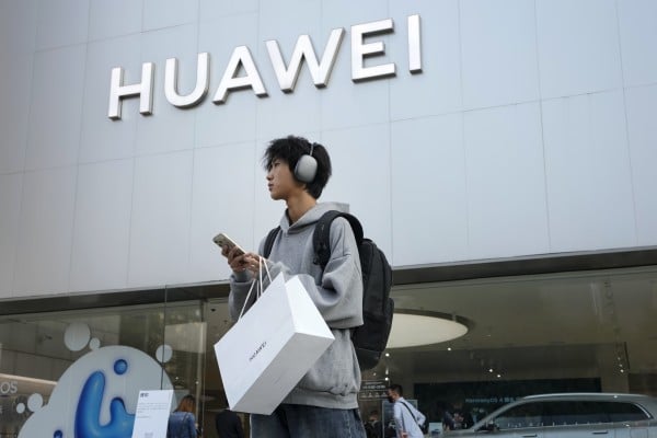 A customer outside a Huawei store in Beijing. Photo: AP