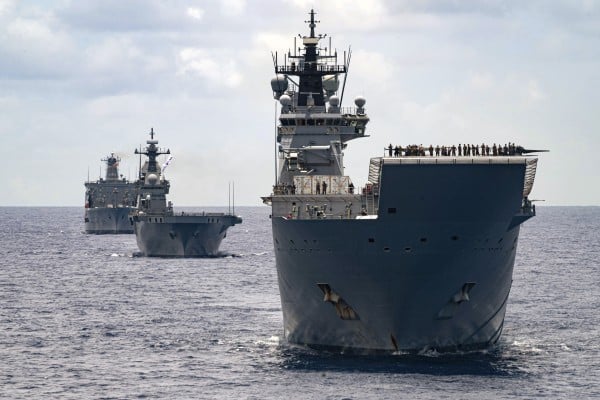 Royal Australian Navy ships Canberra, Supply and Warramunga sail in formation during US-led maritime drills in the Pacific in 2022. Photo: Australian Defence Force via AP