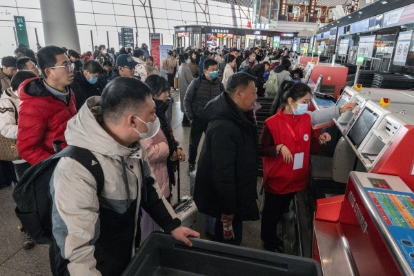 Travelers at Beijing Capitol Airport, Feb. 1, 2024. Photo: Bloomberg