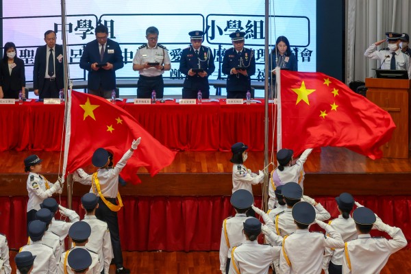 Hong Kong school pupils participate in a flag-bearing competition. Photo: Jonathan Wong