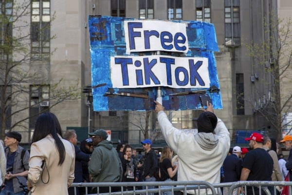 A protester carries a Free TikTok sign in front of the courthouse where Donald Trump’s hush-money trial is under way in New York. Photo: AP
