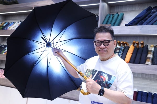 Leung Mang-sing, the fourth-generation owner of Leung So Kee Umbrella Factory, one of the oldest handmade umbrella manufacturers in China, holds one of the company’s items at its Park Lane Shopper’s Boulevard store in Tsim Sha Tsui, Hong Kong. Photo: Yik Yeung-man Leung Mang-sing, the fourth-generation owner of Leung So Kee Umbrella Factory, one of the oldest handmade umbrella manufacturers in China, holds one of the company’s items at its Park Lane Shopper’s Boulevard store in Tsim Sha Tsui, Hong Kong. Photo: Yik Yeung-man