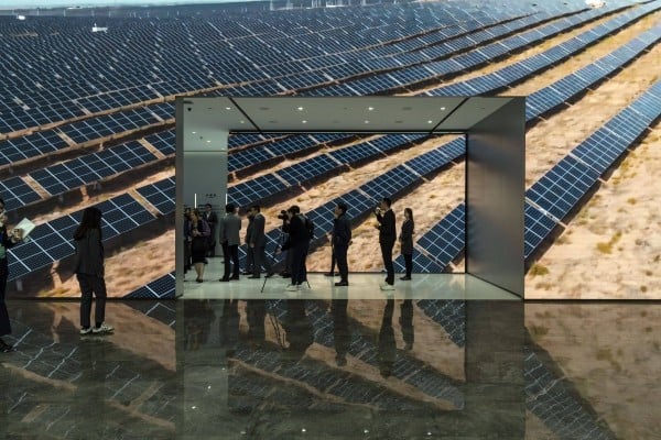 Visitors walk through the lobby of a solar power company’s headquarters in Hefei, Anhui province. Photo: Bloomberg