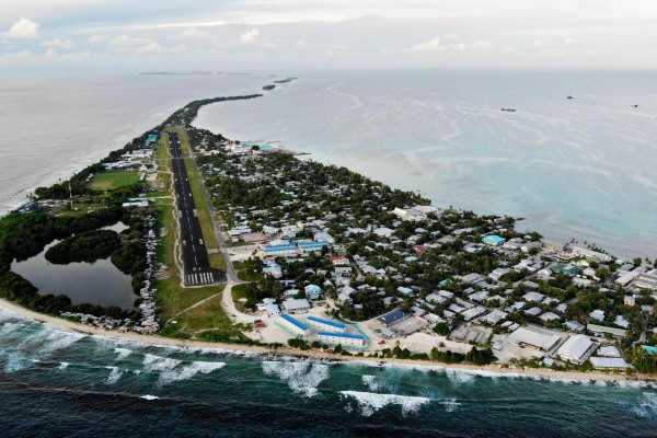 An aerial view of downtown and the airport runway in Funafuti, Tuvalu. Australia  said it will quadruple its financial help to Tuvalu, as China also courts small island states. Photo: Getty Images
