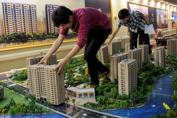 Model flats being set up at a real estate exhibition in eastern China. Beijing has highlighted how a healthy property market is linked to social wellness and economic development. Photo: Reuters