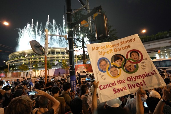 Demonstrators staged a protest against the Tokyo 2020 Olympic Games outside the National Stadium during the opening ceremony. Photo: EPA-EFE