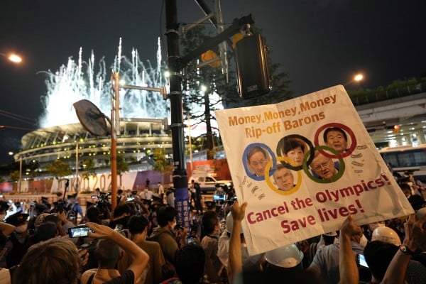 Demonstrators staged a protest against the Tokyo 2020 Olympic Games outside the National Stadium during the opening ceremony. Photo: EPA-EFE Demonstrators staged a protest against the Tokyo 2020 Olympic Games outside the National Stadium during the opening ceremony. Photo: EPA-EFE