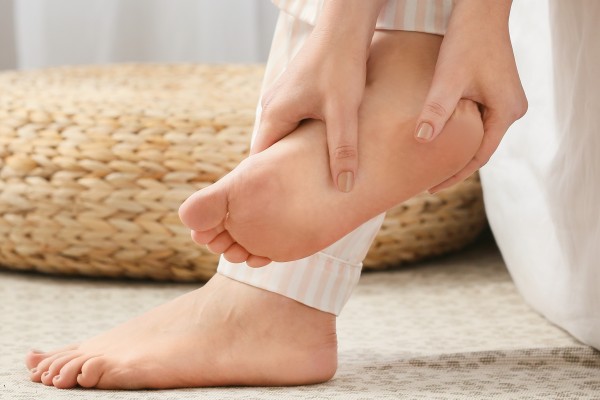 To relieve things such as stress, headaches, menstrual cramps or poor sleep, traditional Chinese medicine practitioners recommend foot acupuncture and foot acupressure massage (above). Photo: Shutterstock