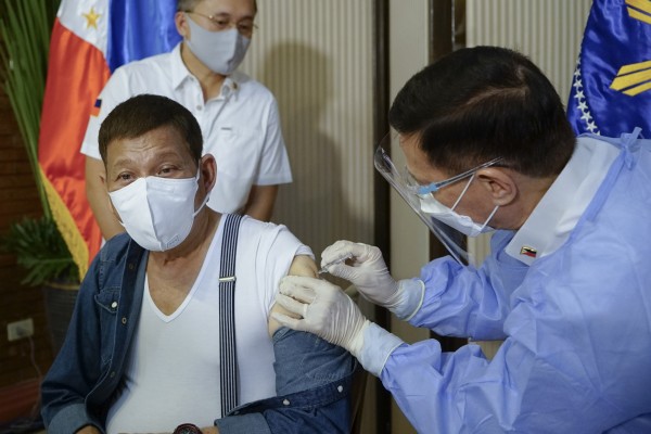 Rodrigo Duterte, then president of the Philippines, receives a Chinese Covid-19 vaccine at the presidential palace in Manila on May 3, 2021, to encourage more Filippinos to get vaccinated amid the pandemic. Photo: Malacanang Presidential Photographers Division via AP