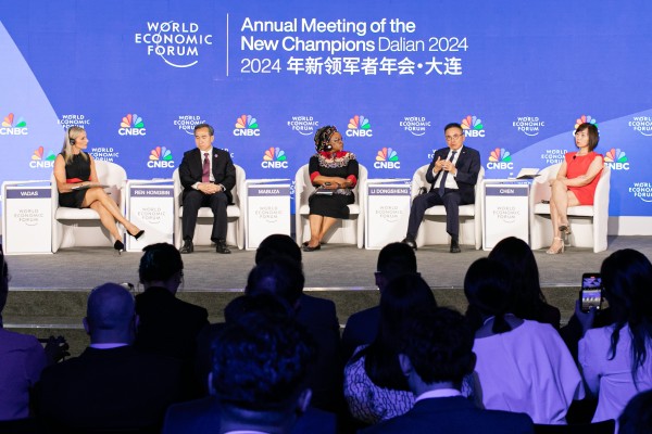 Li Dongsheng (second right) and Ren Hongbin (second left) during a session at the Annual Meeting of the New Champions in Dalian. Photo: World Economic Forum