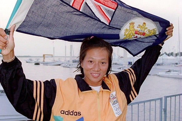 Lee Lai-shan holds up the Hong Kong flag after winning the territory’s first Olympic medal, a sailing gold, at the 1996 Atlanta Games. Lee Lai-shan holds up the Hong Kong flag after winning the territory’s first Olympic medal, a sailing gold, at the 1996 Atlanta Games.