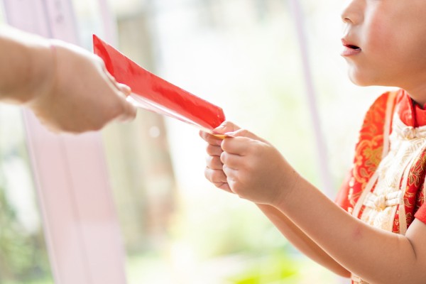 A young boy in China called the police to report a robbery after his father kept his Lunar New Year lucky money. Photo: Shutterstock