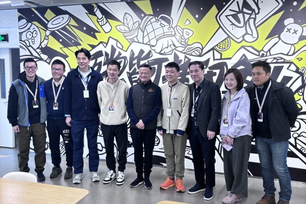 Alibaba founder Jack Ma (fifth from left) visits the offices of second-hand goods platform Xianyu in Hangzhou, capital of Zhejiang province, on Tuesday. Photo: Handout